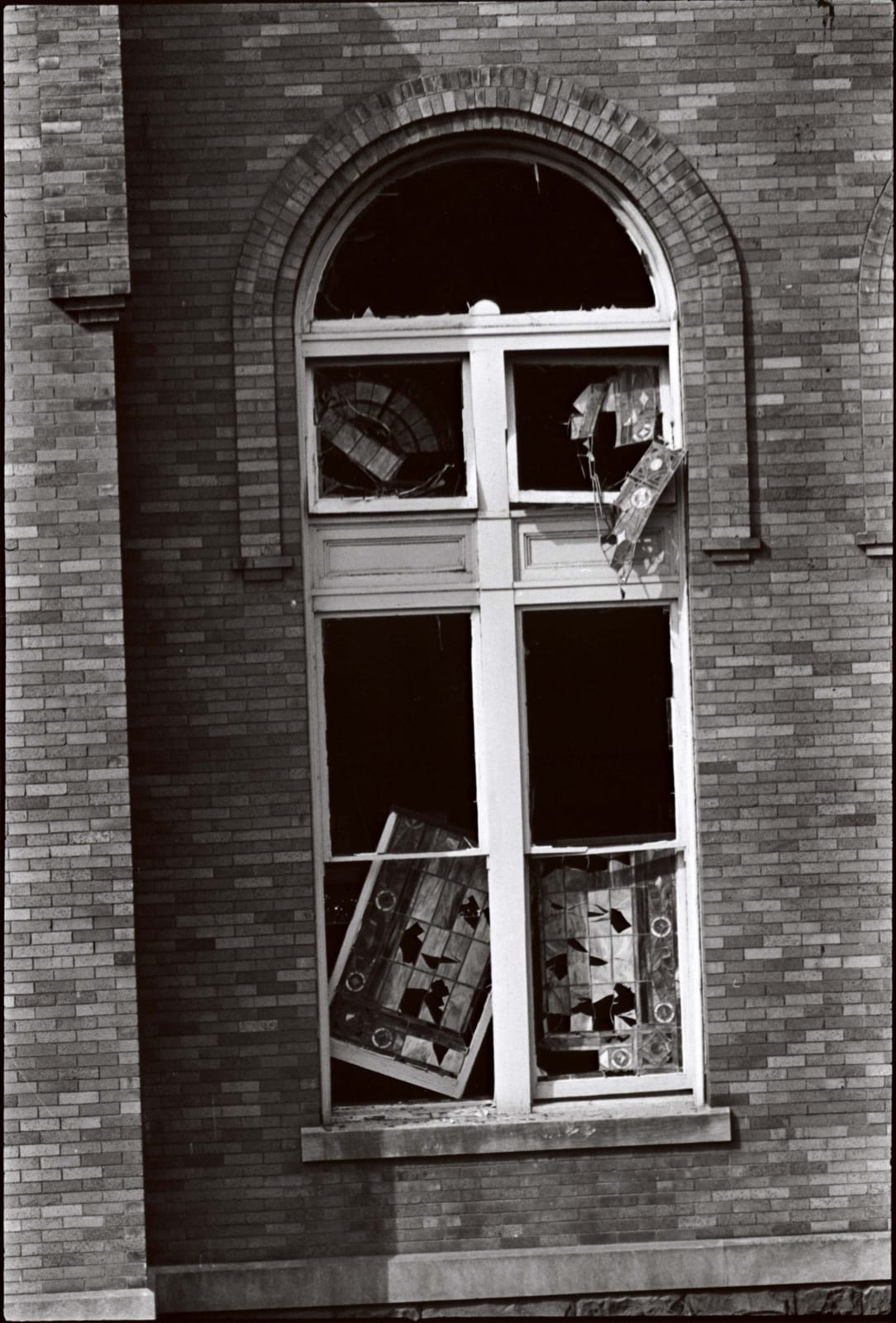 Danny Lyon, The windows of the Sixteenth Street Baptist Church, where four fourteen-year-old girls were killed by a KKK bomb,...