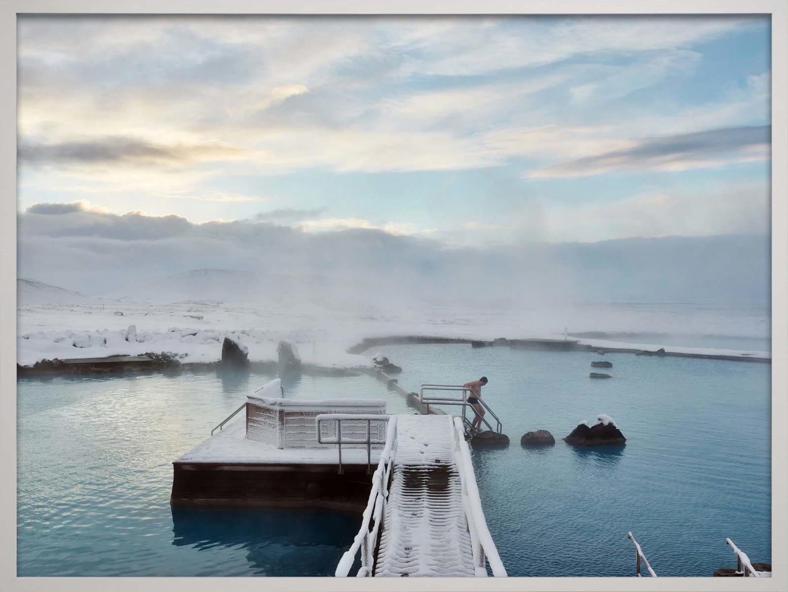 Lone figure stepping into hot pools in Iceland at Myvatn Nature Baths, by Massimo Vitali