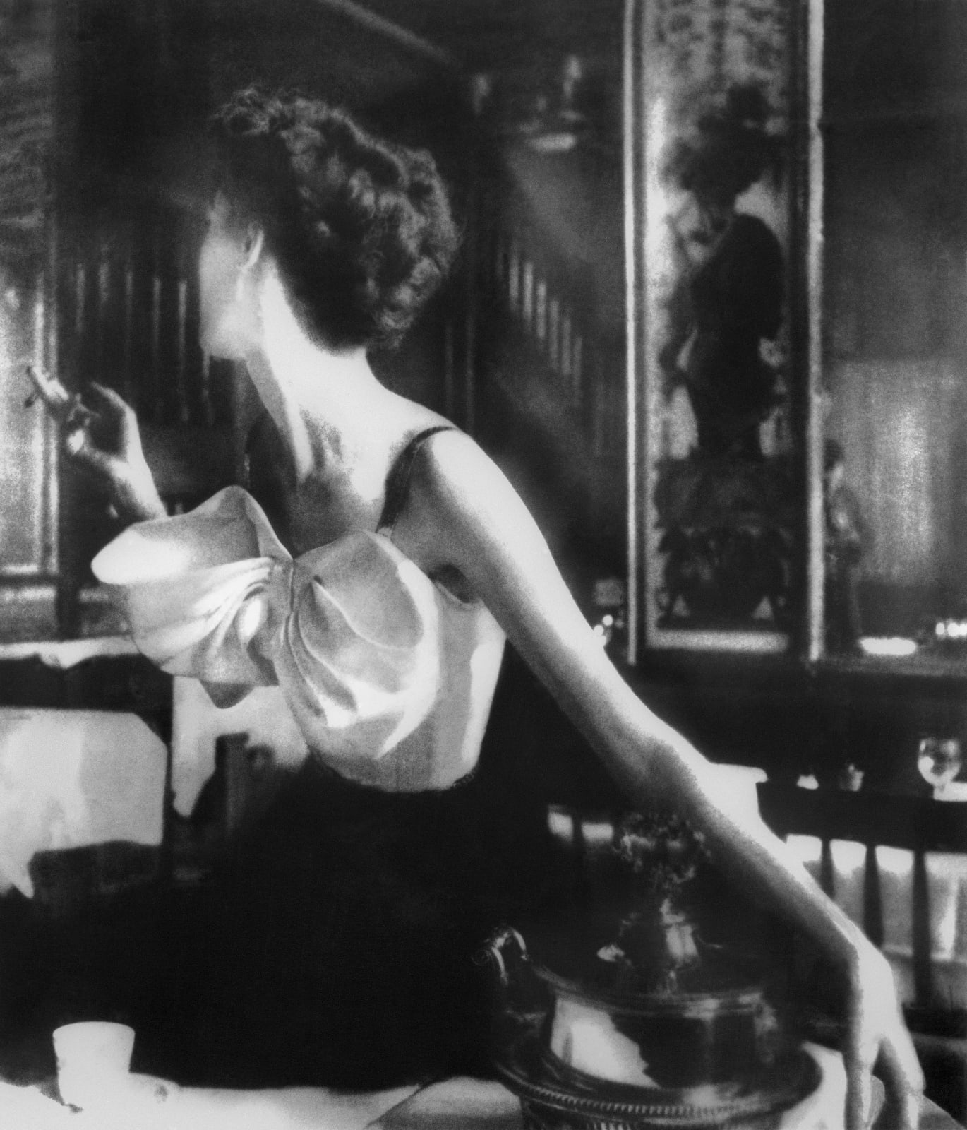 Lillian Bassman black and white photograph of woman in restaurant