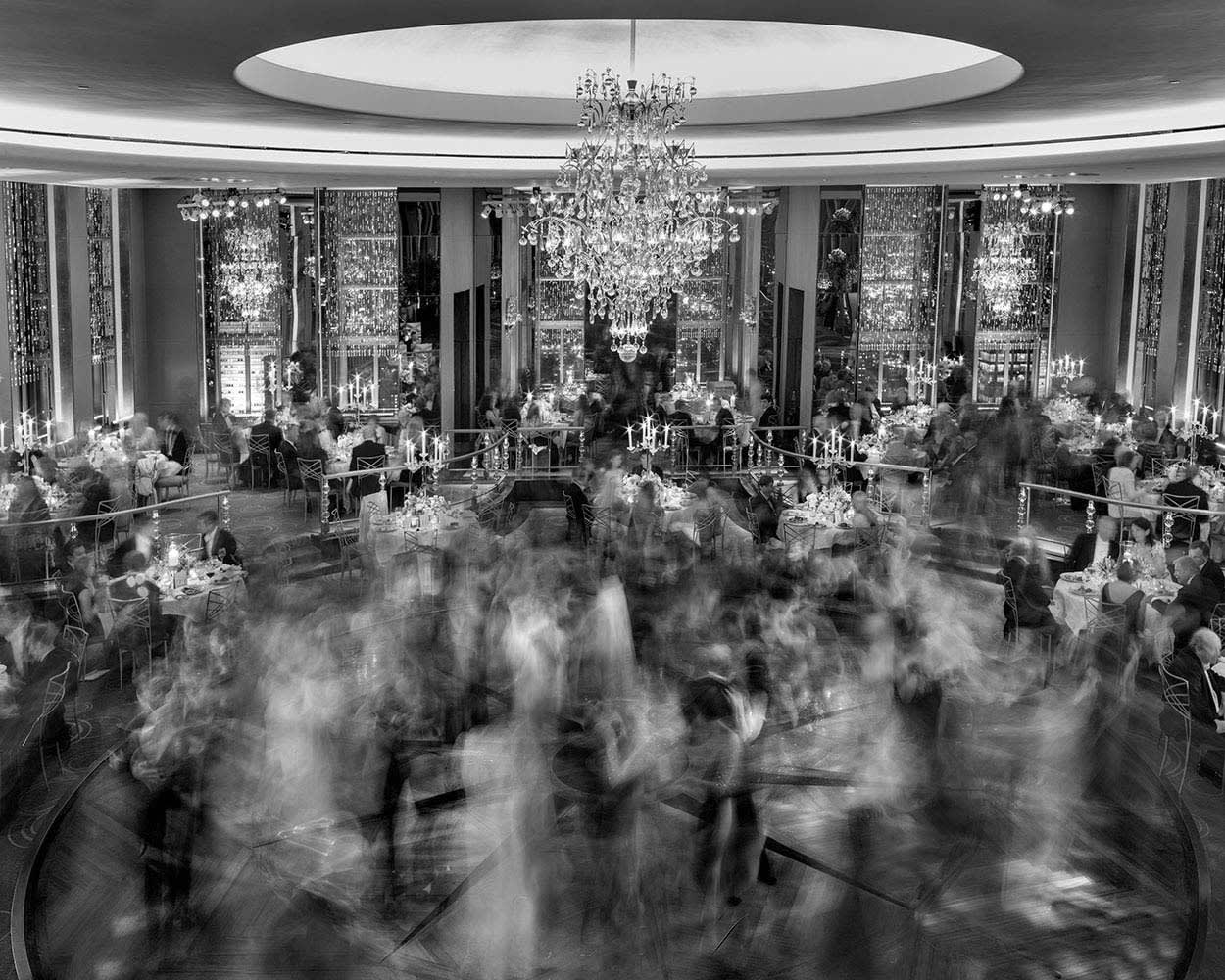 Matthew Pillsbury black and white photograph of people dancing in the Rainbow Room portrayed through long exposure shot