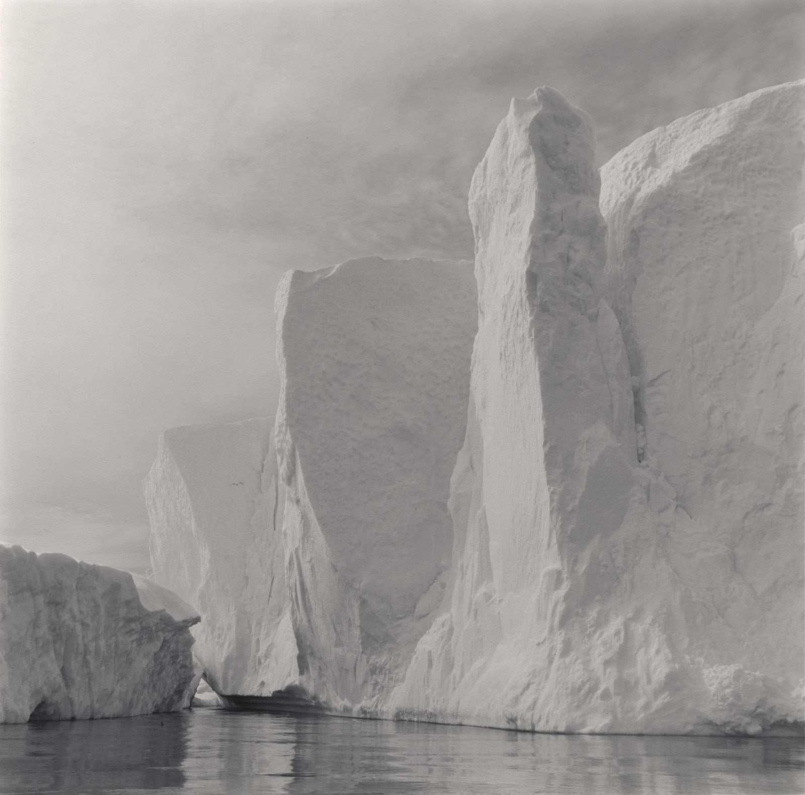 Lynn Davis photograph of iceberg in Disko Bay, Greeland, wiht ice in the shape of a totem pole