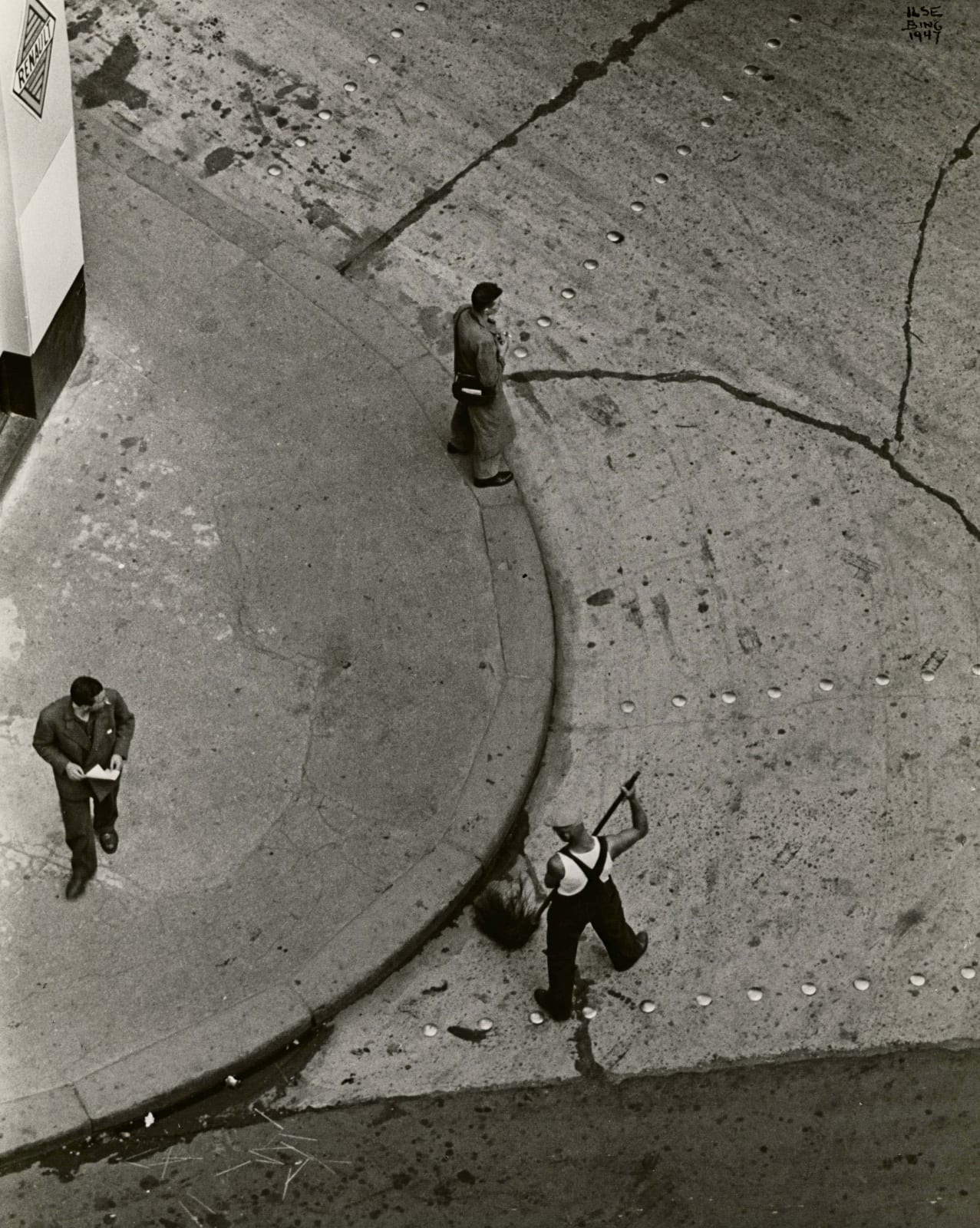 Ilse Bing photograph of street cleaner in Paris from apartment building