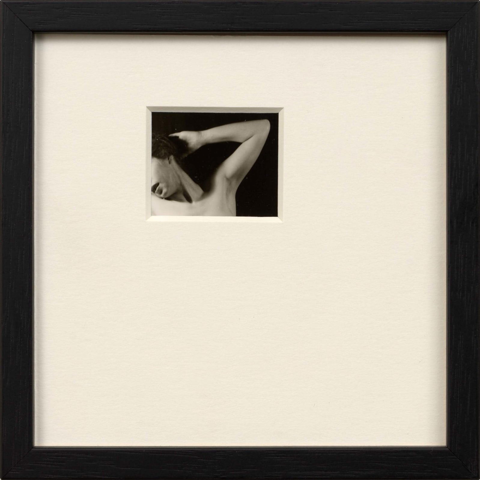 Framed artwork by Sissi Farassat featuring a black-and-white photo of a nude figure in a minimal composition with wide matting.