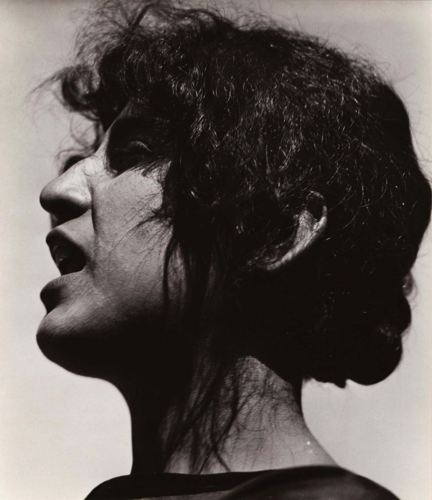 portrait of Tina Modotti, mid-speech with her mouth agape, taken in Guadalupe, Mexico by Edward Weston