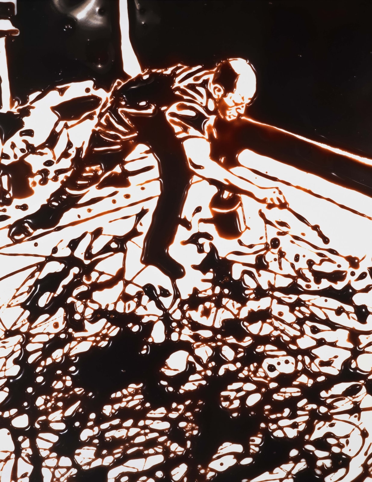 Vik Muniz photograph of Jackson Pollock making an action painting rendered in chocolate syrup against white background
