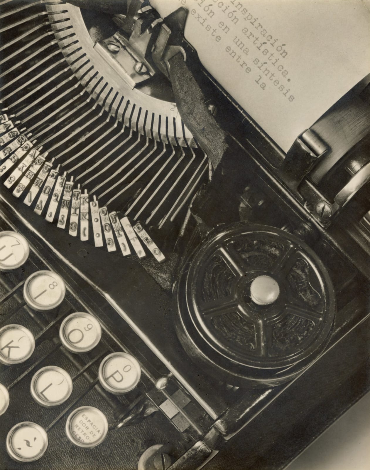 close-up photograph of typewriter with writing in Spanish on paper by Tina Modotti