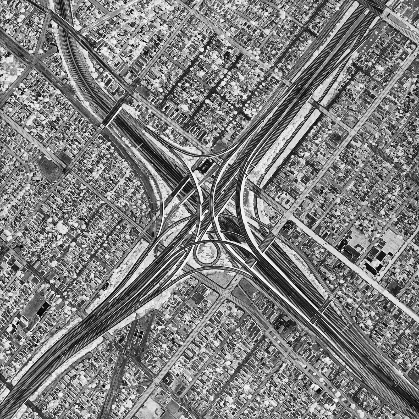 black and white aerial photograph of dense urban grid and freeways in Los Angeles, by David Maisel