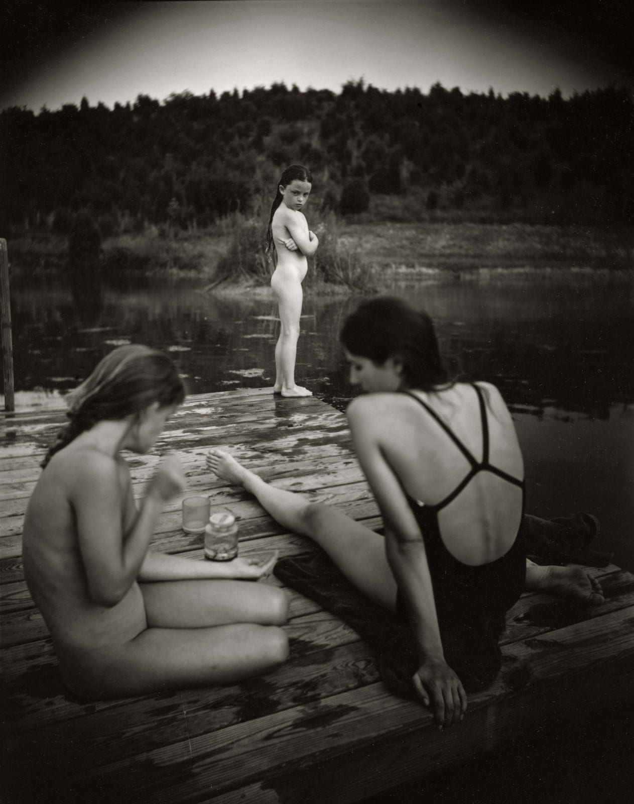 Virginia at the end of the dock looking at the big girls jealously, from the Immediate Family series by Sally Mann
