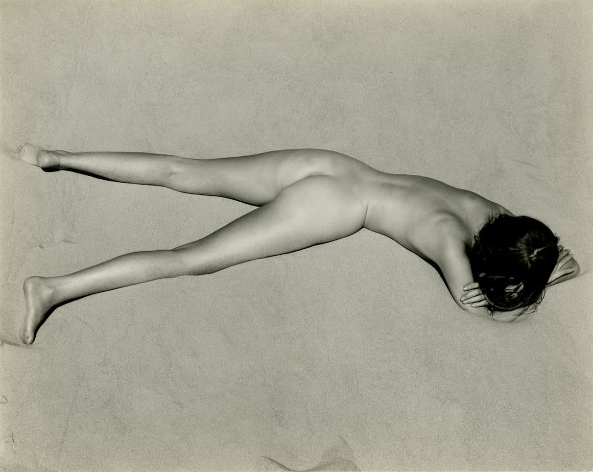 Edward Weston Nude on Sand with face down and hands on folded arms