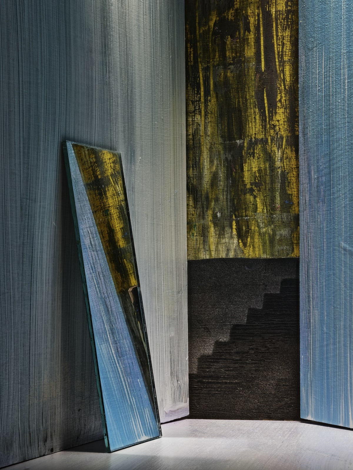 mirror and stairway in painted room