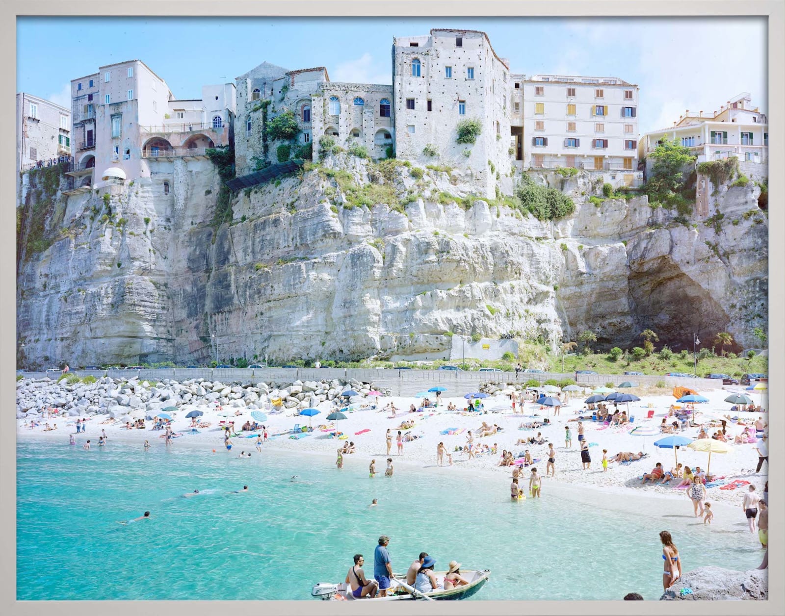 View of Tropea beachside with boat in ocean, made in Calabria Italy, by Massimo Vitali