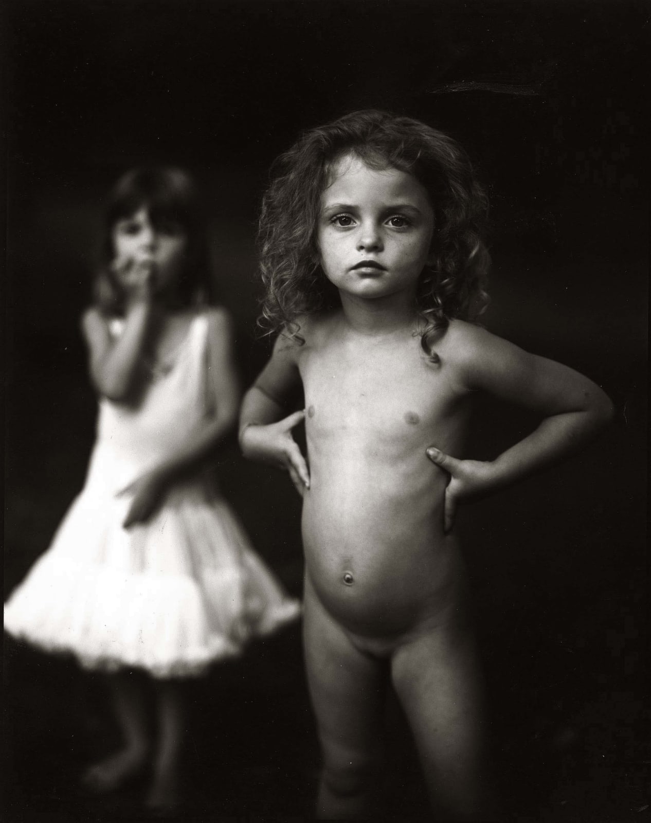 Virginia at four with hands on waist from the Immediate Family series by Sally Mann
