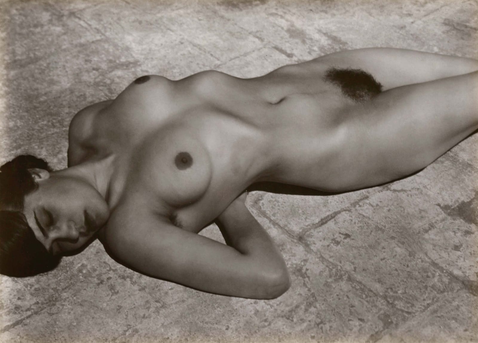 Edward Weston photograph of Tina Modotti nude lying on the rooftop