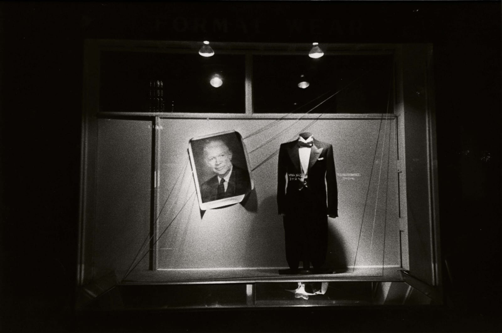 Robert Frank Washington DC storefront window with tuxedo and picture of President Eisenhower