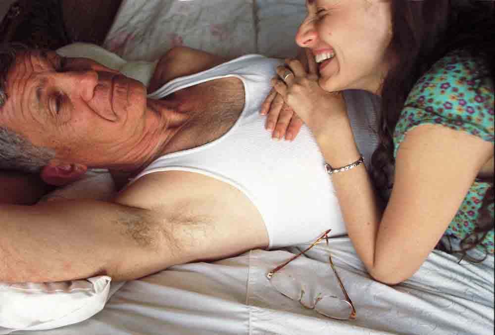 Elinor Carucci Joke woman lying on her fathers stomach and laughing