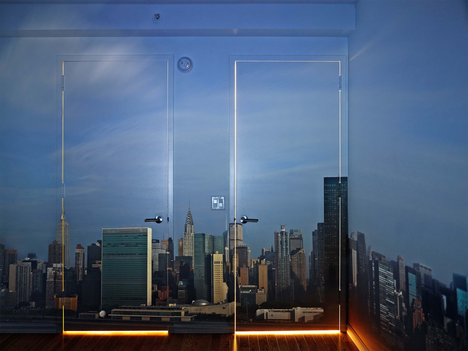 Abelardo Morell Camera Obscura Early Morning View of the East Side of Midtown Manhattan skyline projected in empty room with two doors