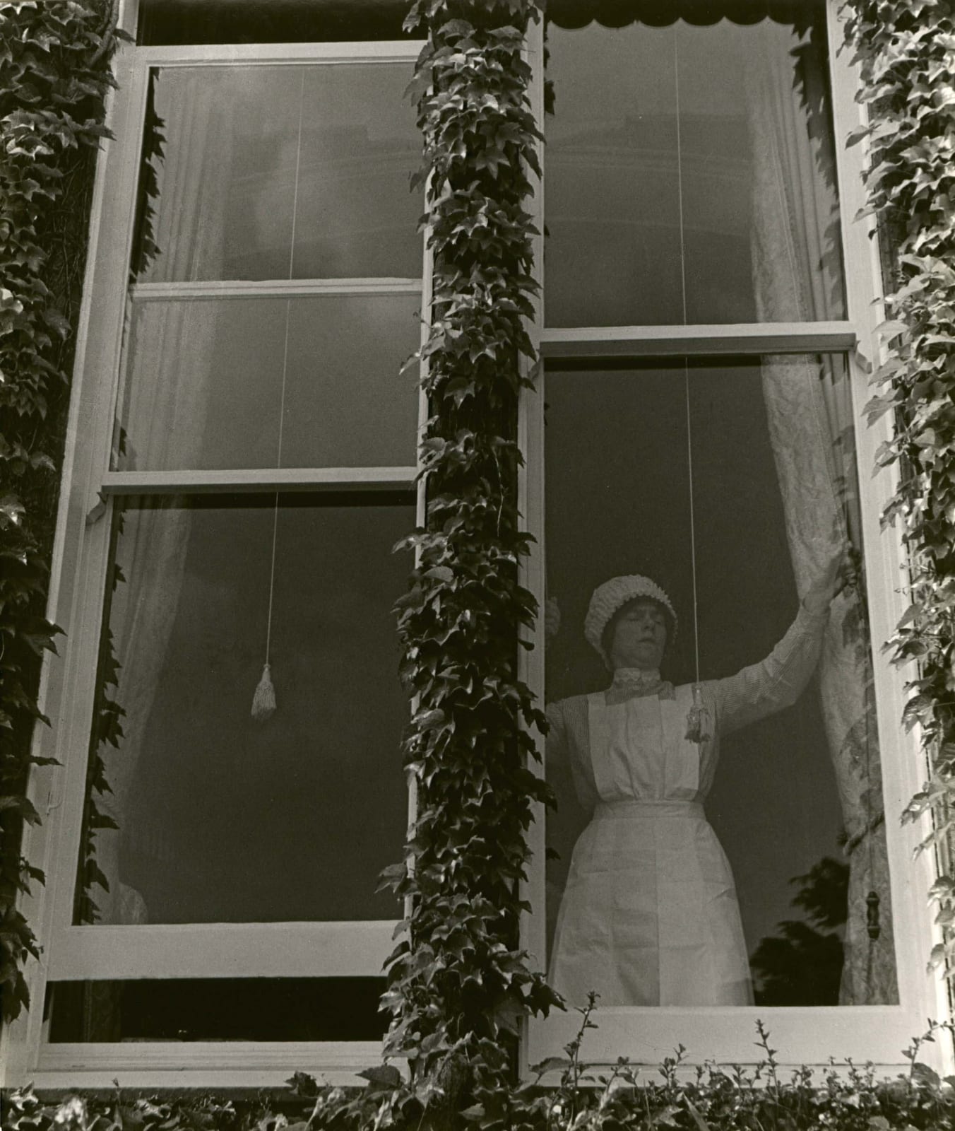 Bill Brandt, Parlourmaid at a Window in Kensington, c. 1939