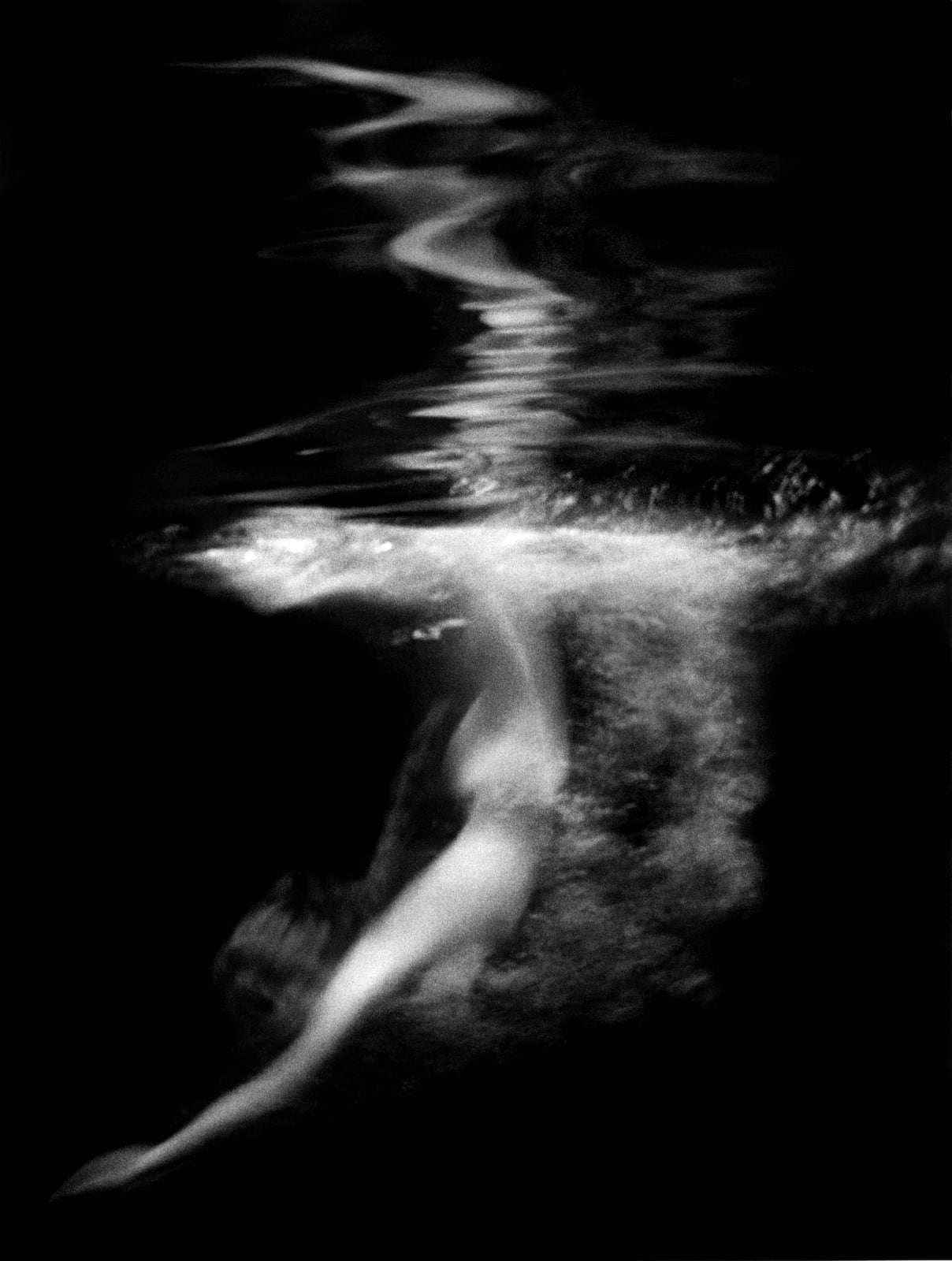 nude woman diving into pool, by Lillian Bassman
