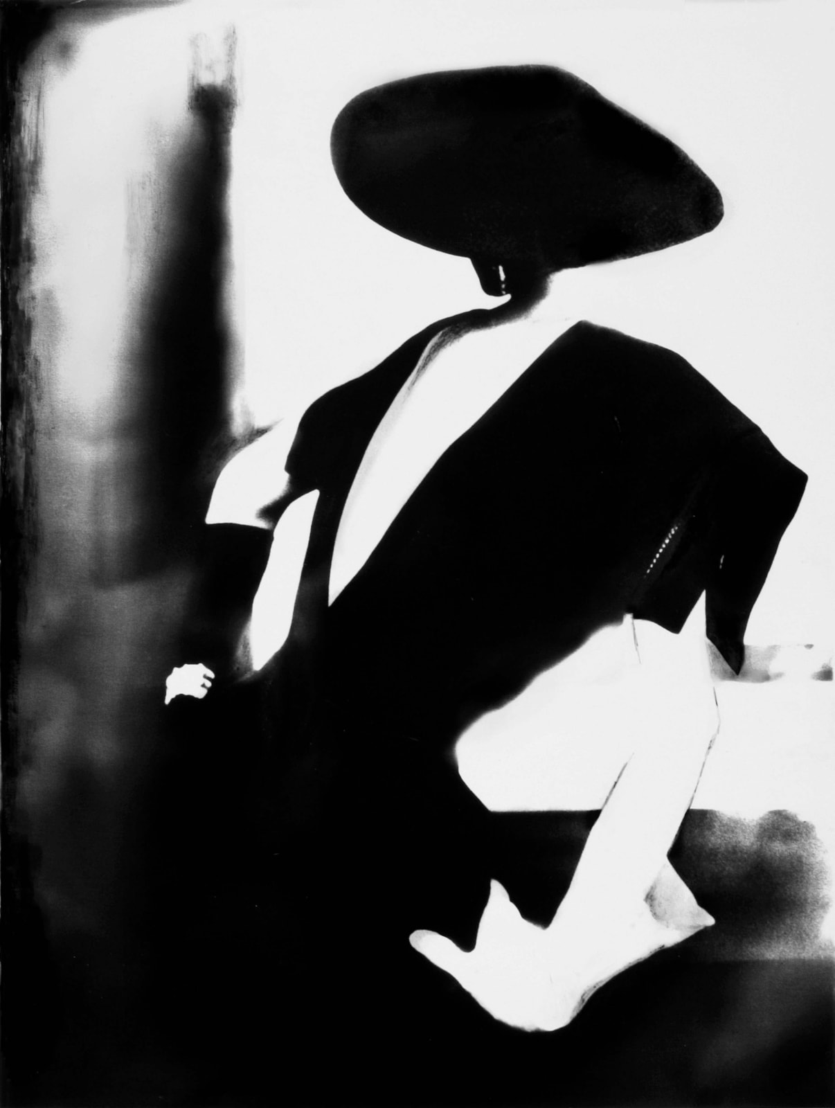 Lillian Bassman photograph of model Barbara Mullen wearing Christian Dior dress with V-neck back, black hat, and one white glove