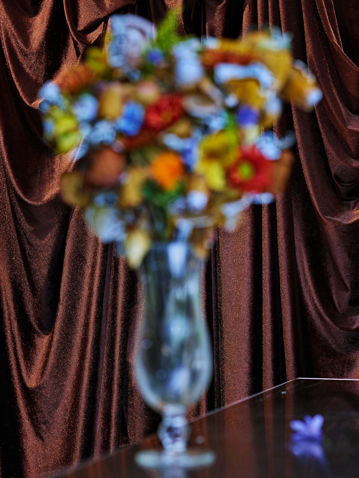 Abelardo Morell Flowers for Lisa #70 After Douglas Sirk vase of brightly colored Technicolor flowers out of focus with glittering brown curtain 