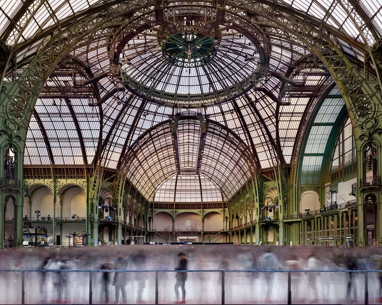 Matthew Pillsbury photograph of Grand Palais in Paris with people ice skating portrayed through long exposure shot