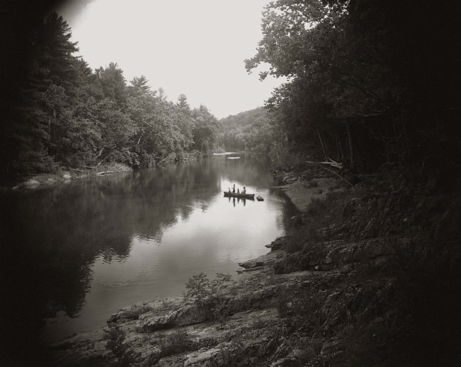 Emmett, Jessie and Virginia in a canoe crossing the Maury River, from the Immediate Family series by Sally Mann