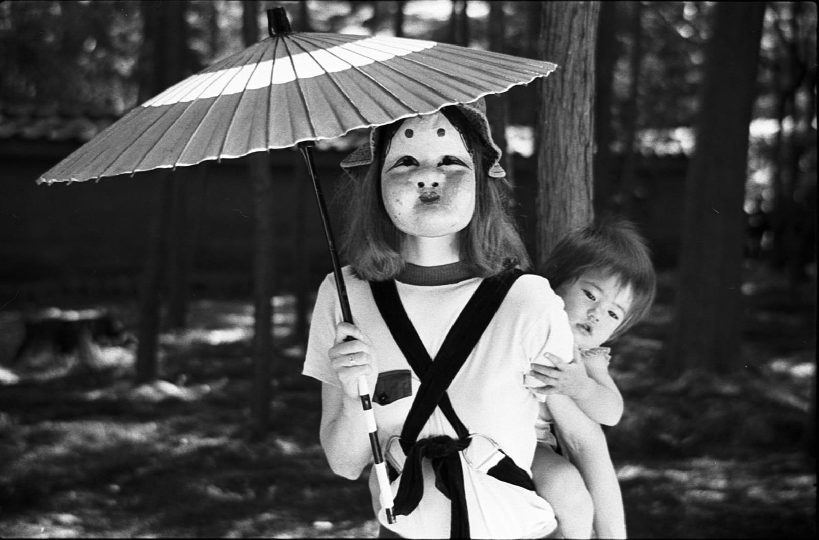 Hideoki, Mary holding parasol, Japan, 1973