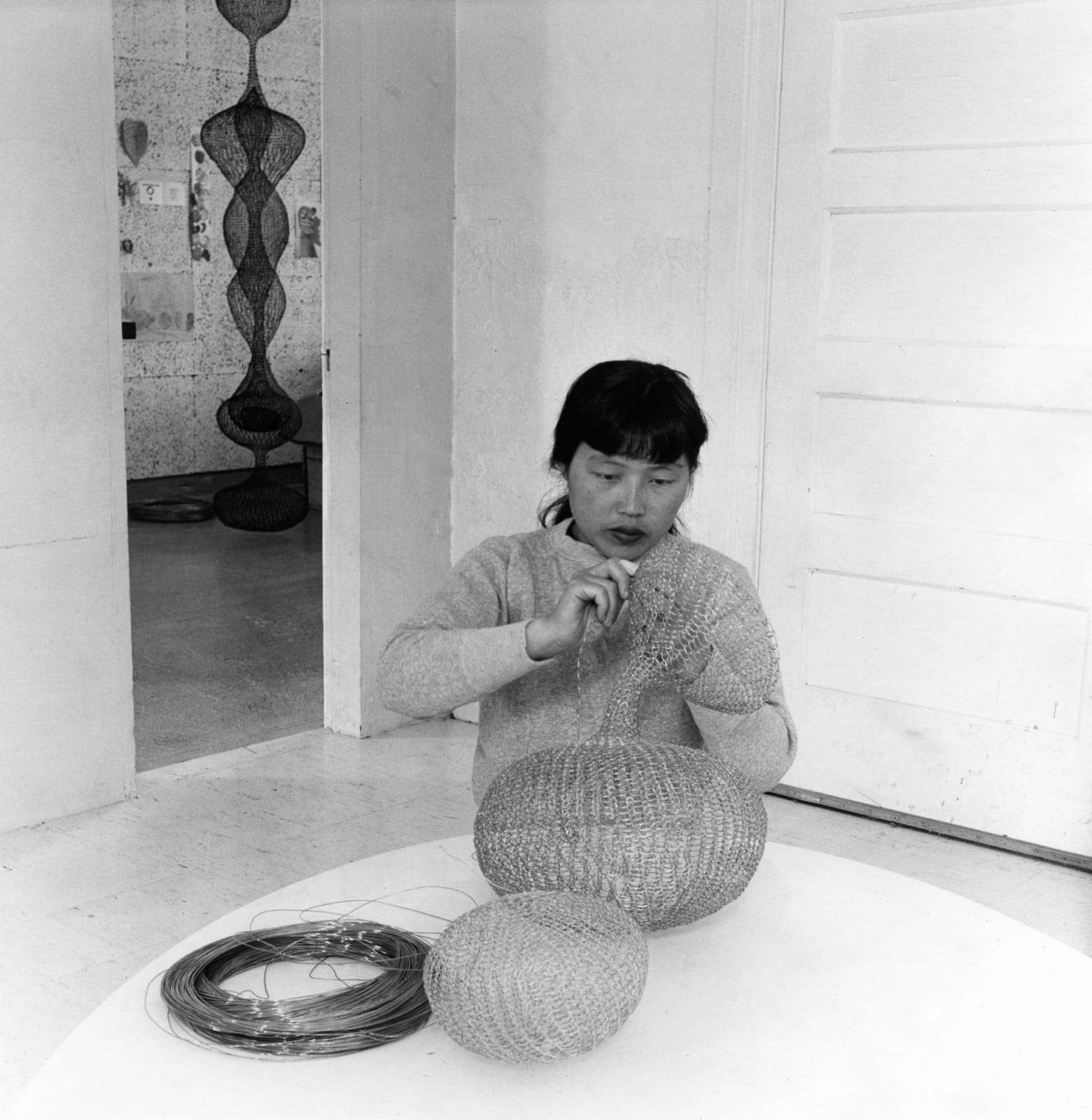 Imogen Cunningham, Ruth Asawa Working on Her Wire Sculpture, 1956