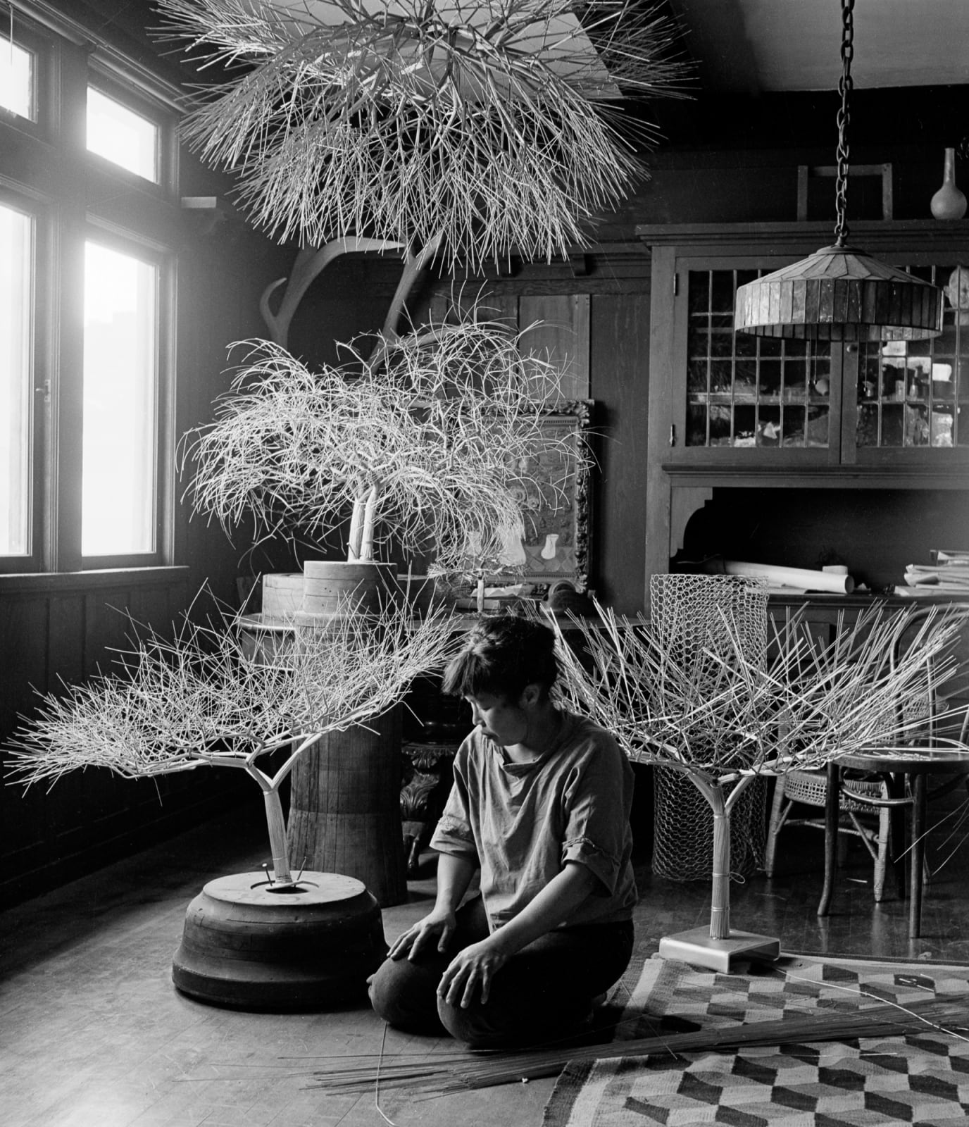 Imogen Cunningham, Ruth Asawa in Her Dining Room with Tied-Wire Sculptures, 1963