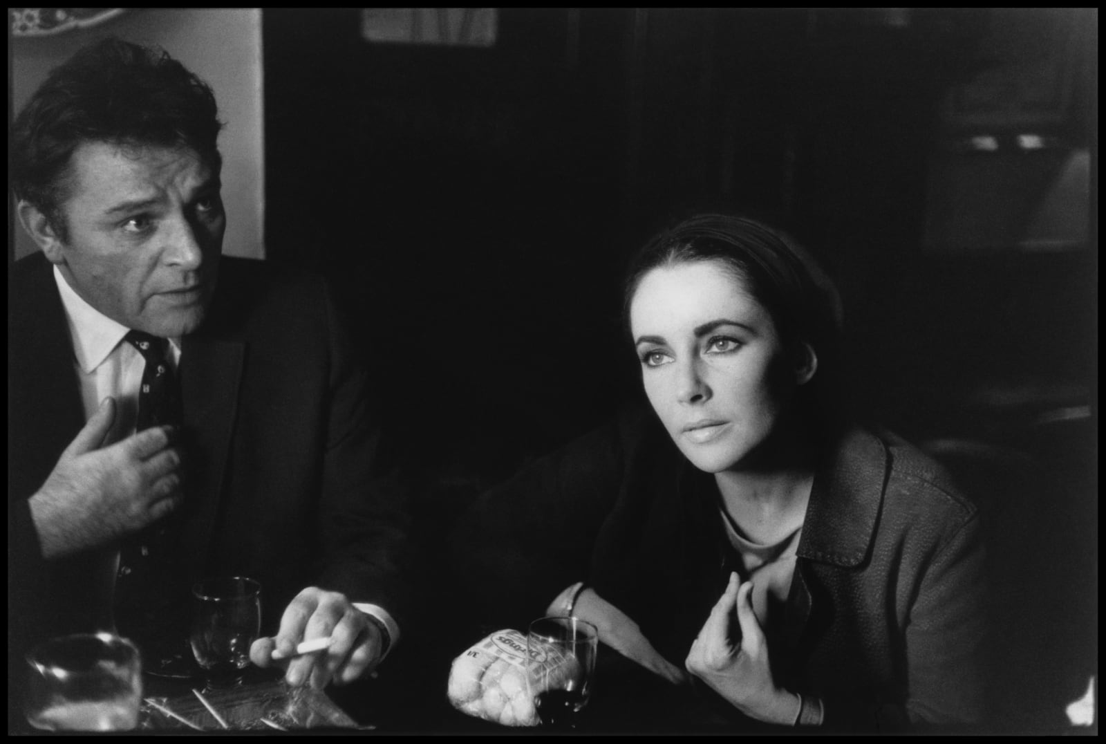 Eve Arnold, Welsh actor Richard Burton and American actress Elizabeth Taylor in the local pub in Shepperton, England, 1963