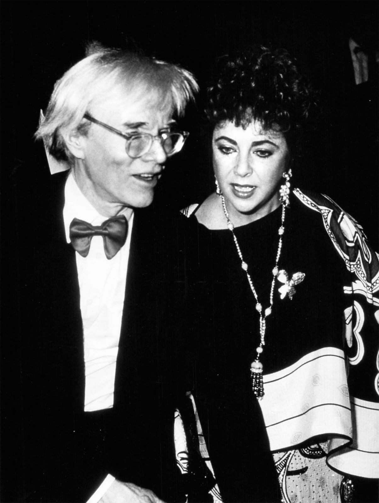 Ron Galella, Andy Warhol and Elizabeth Taylor at a performance of Liza Minelli and Chita Riviera at "The Rink", February 9, 1984