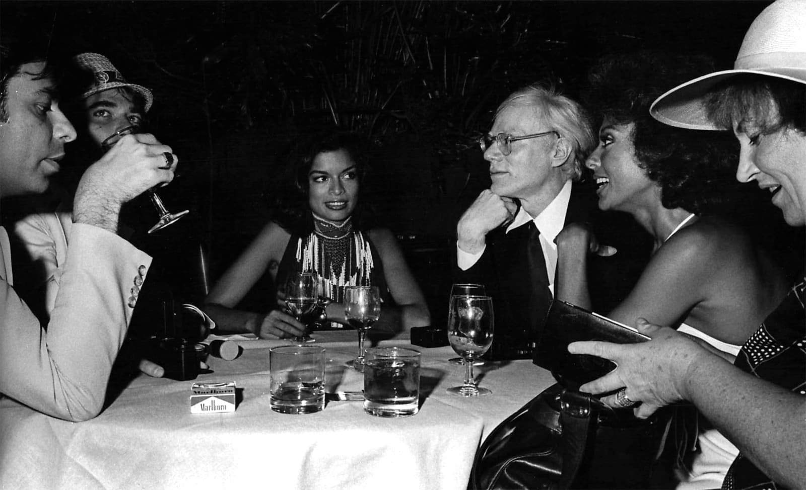 Ron Galella, Bob Colacello, Rex Reed, Bianca Jagger, Andy Warhol, Rita Moreno, and Bella Abzug at "The Ritz" premiere, 4 Seasons, New York City, August 11, 1976