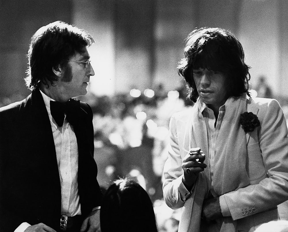 Ron Galella, John Lennon and Mick Jagger at American Film Institute Salute to James Cagney at Century Plaza Hotel in Los Angeles, 1974