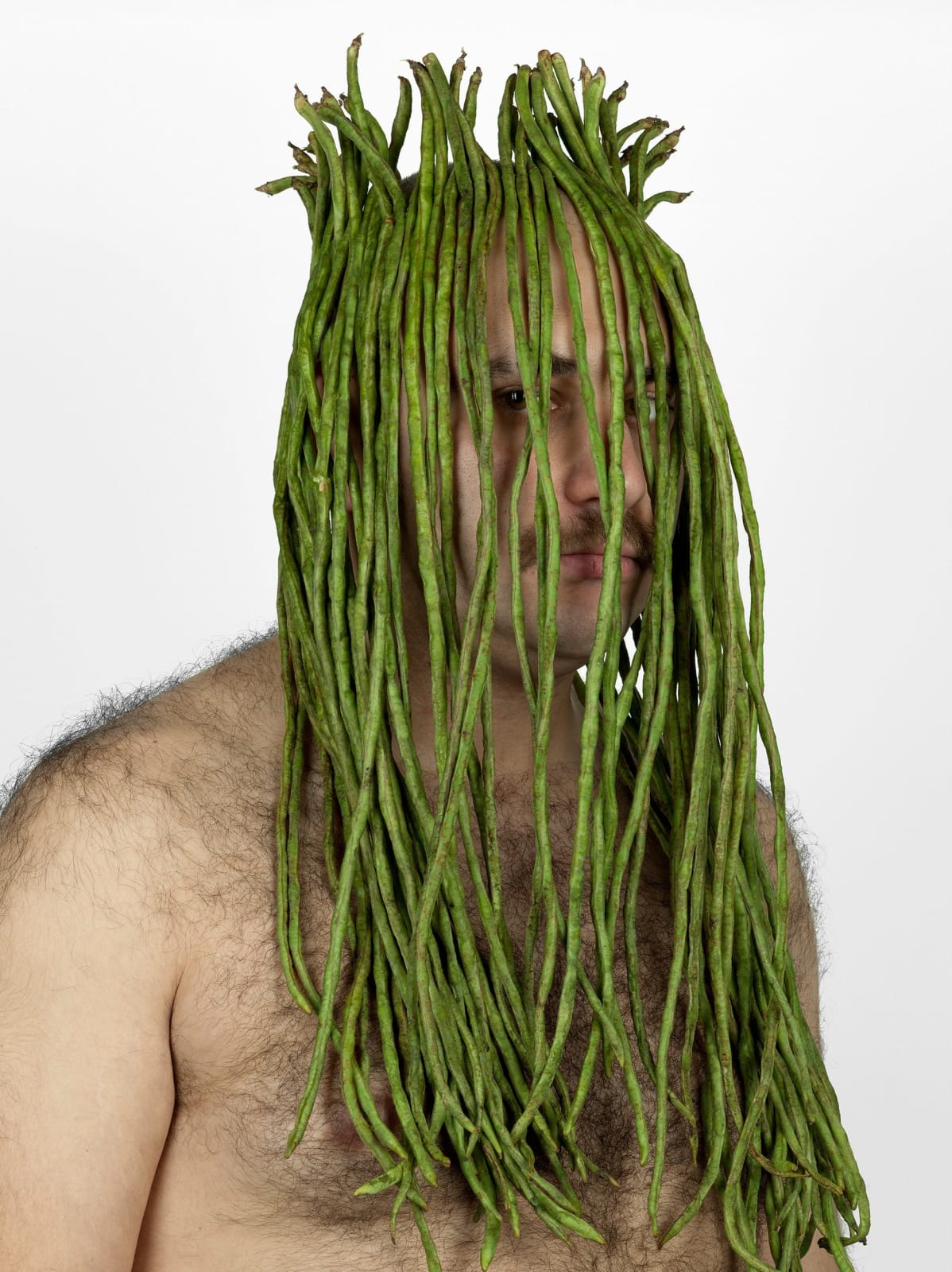 Raed Yassin, Self portrait with Foreign Fruits and Vegetables, 2011