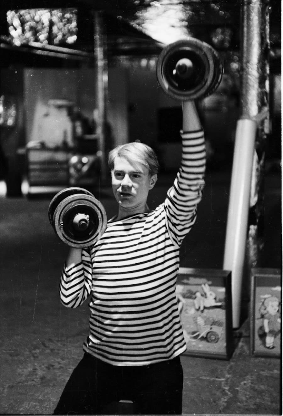Steve Schapiro, Andy Warhol with Weights, The Factory, New York, 1965