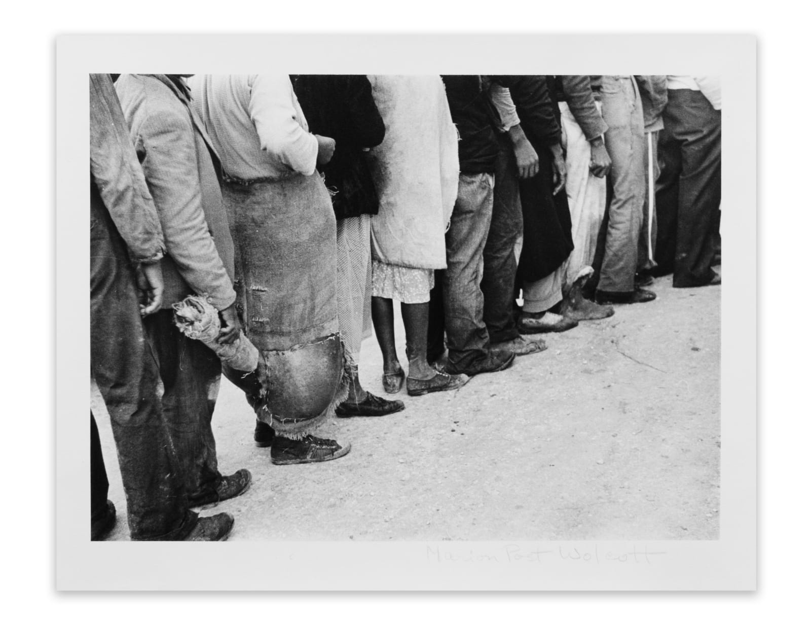 Marion Post Wolcott, Migrant vegetable pickers waiting in line to be paid, behind truck in field near Belle Glade, Fla., 1939