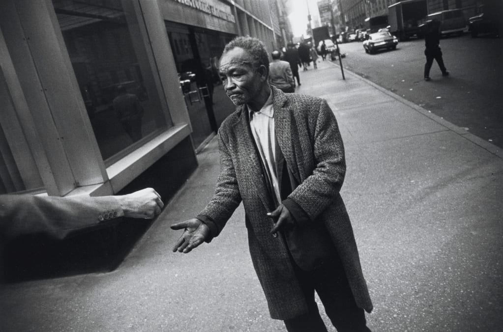 Garry Winogrand, New York City (man accepting handout) Garry Winogrand Portfolio, Hyperion Press, 1978, 1968