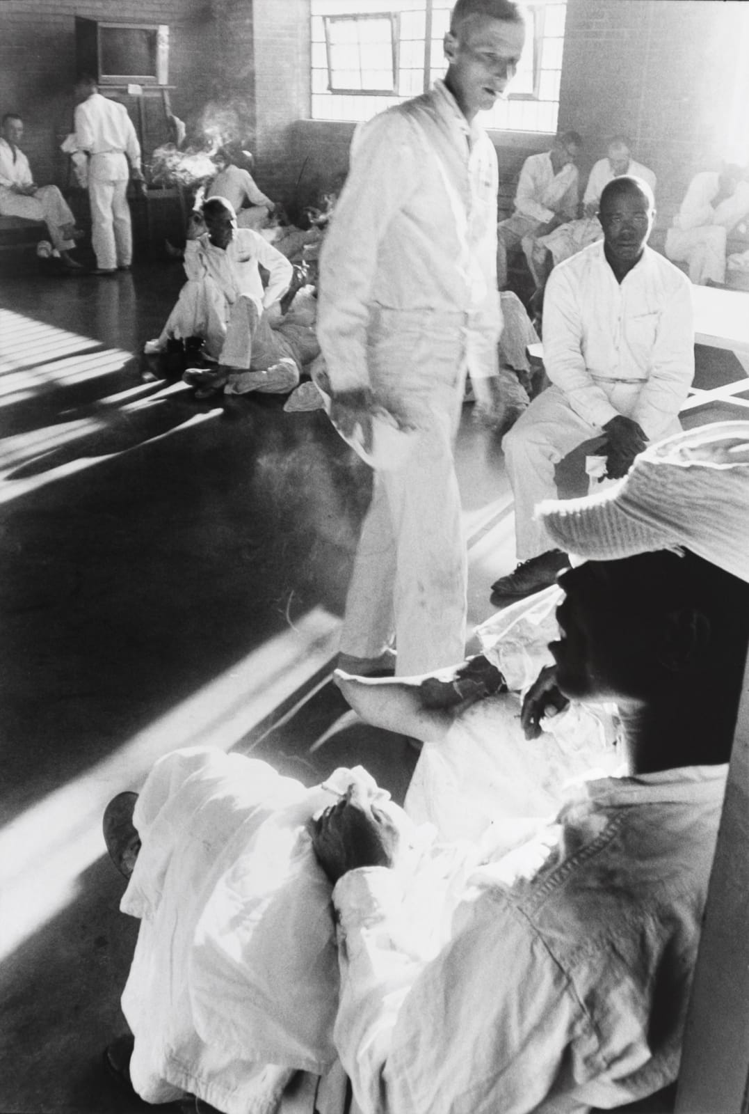 Danny Lyon, Prison Series (Gathering and Smoking Cigarettes), 1968