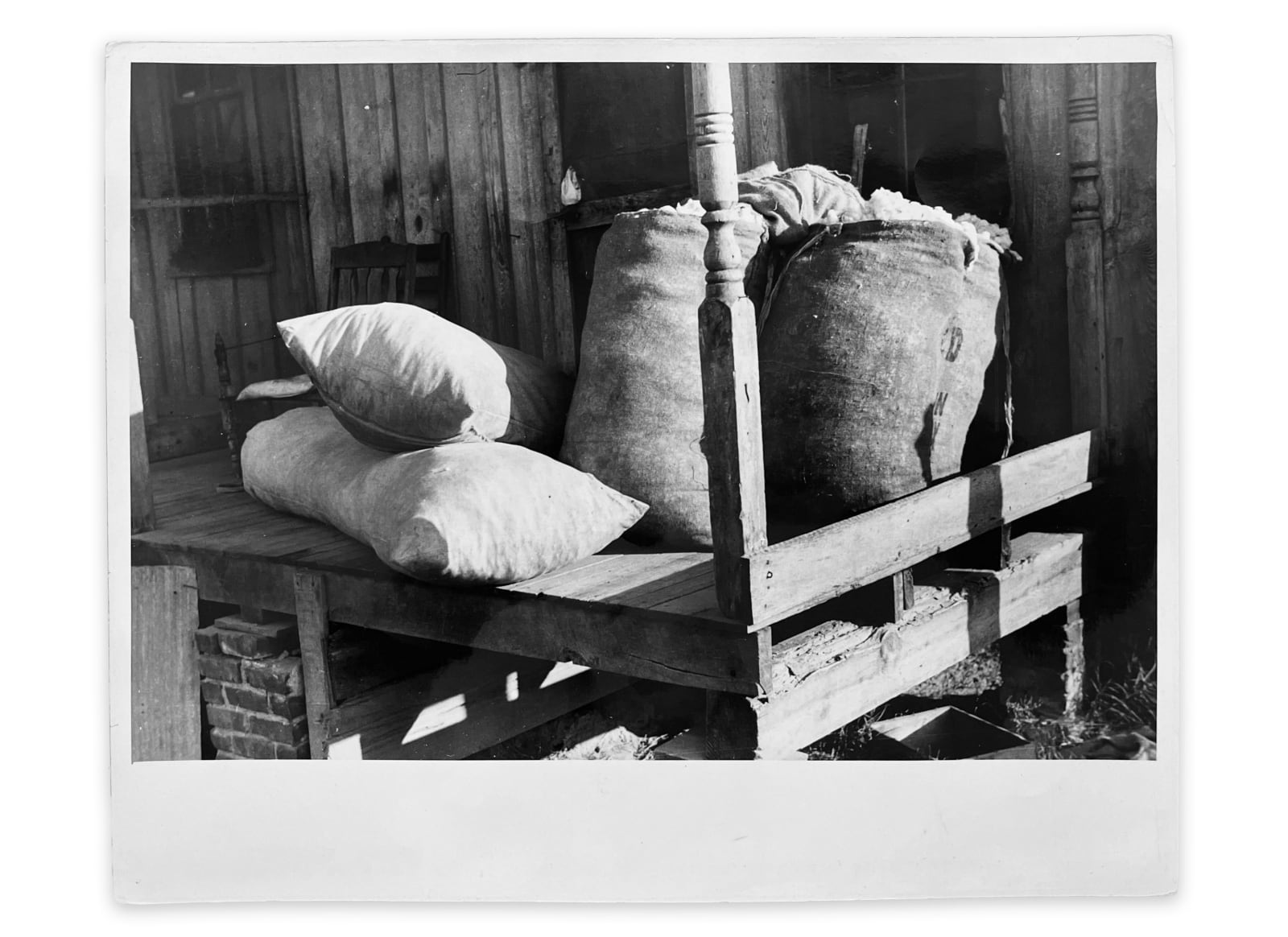 Marion Post Wolcott, Sacks of cotton on wagehand's porch, Knowlton Plantation, Perthshire, Mississippi Delta, Mississippi, 1939