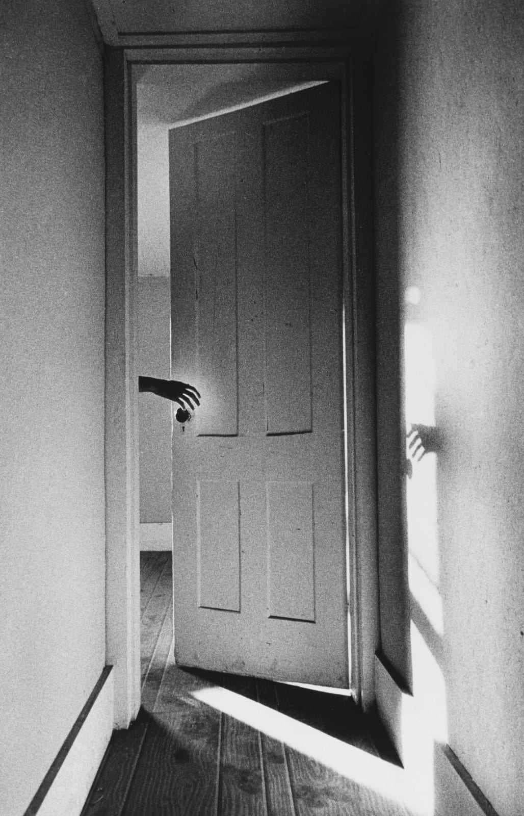 Ralph Gibson, Hand through Door, from The Somnambulist, 1969