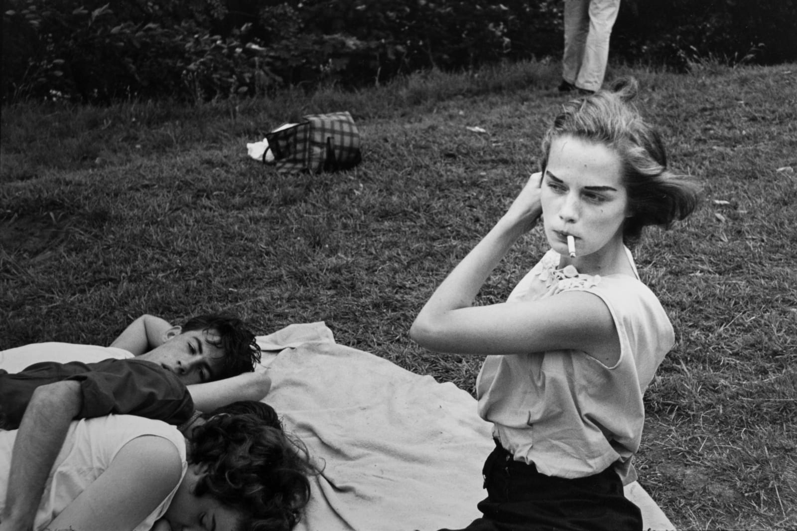 Bruce Davidson, Brooklyn Gang (girl smoking with group in park), 1959