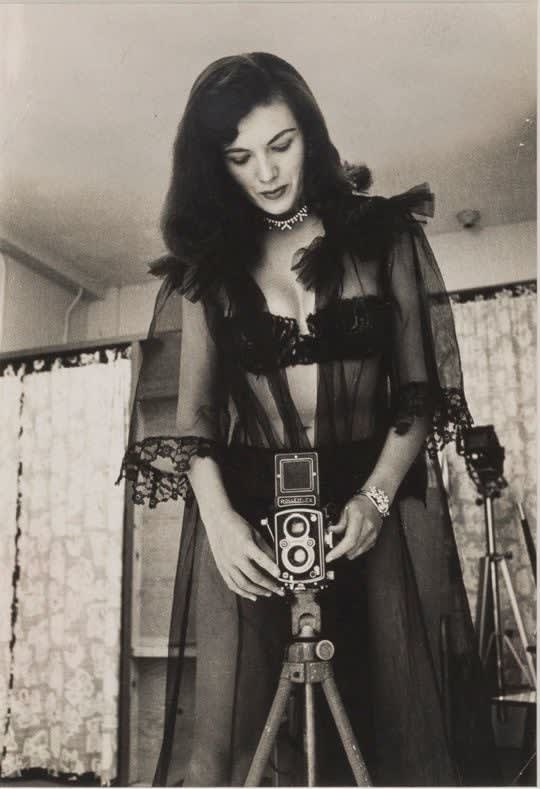 Mike Shea, Bunny Yeager in Black Lace with Her Rolleiflex Camera, 1955