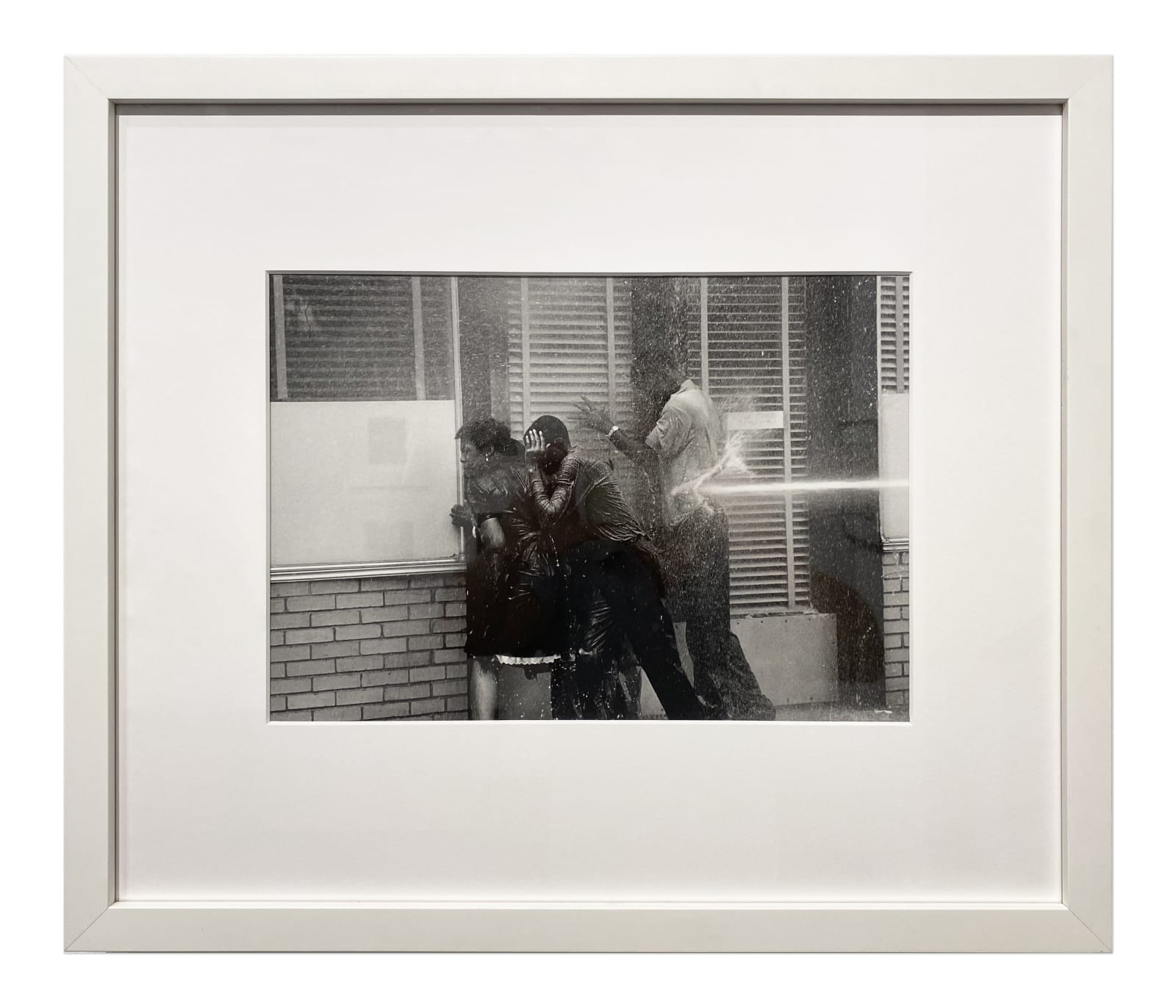 Charles Moore, Three People in Doorway Being Fire Hosed, Birmingham, AL, 1963