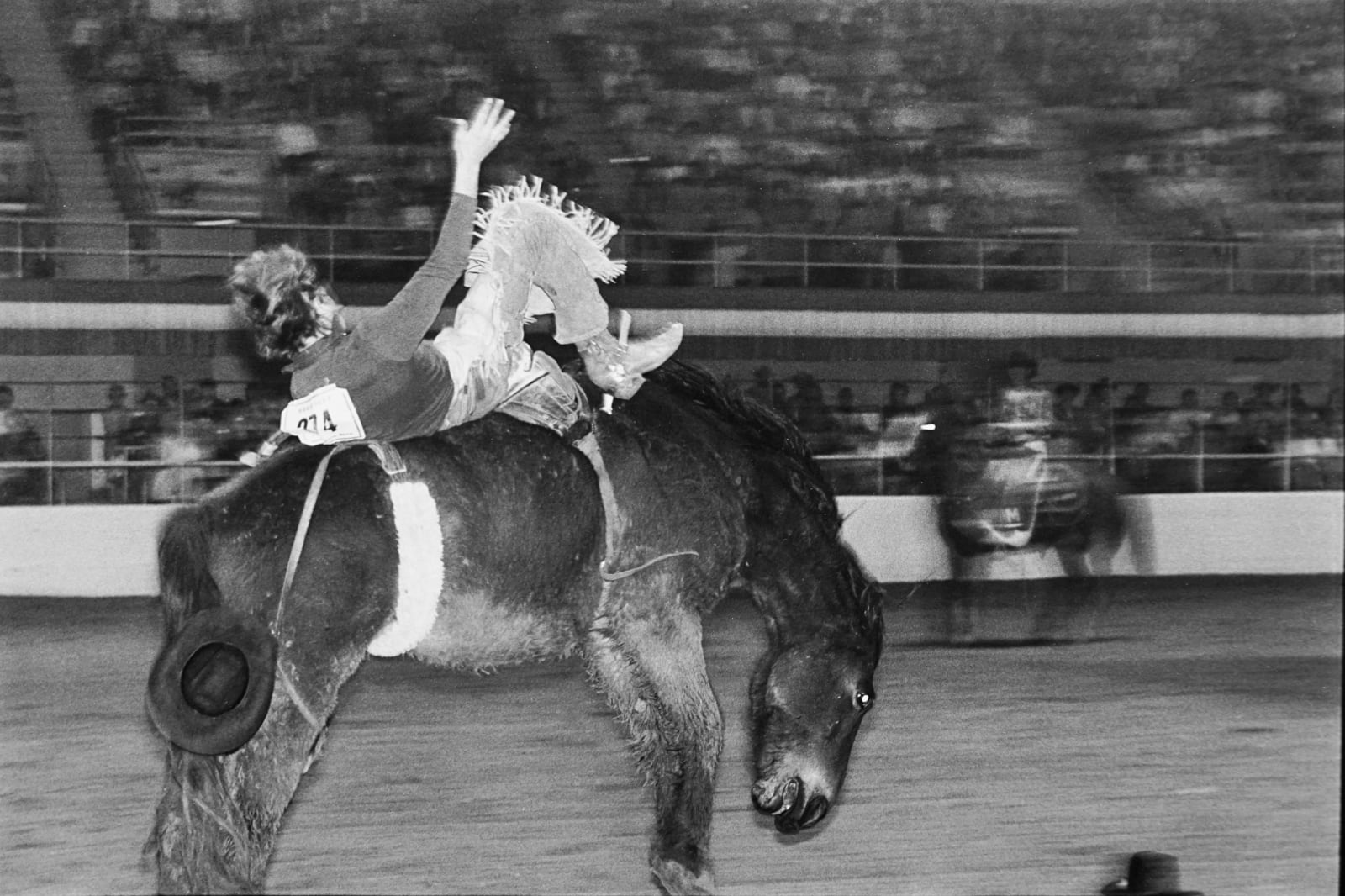 Garry Winogrand, Cowboy, Hat on Edge of Frame, Rodeo, 1974
