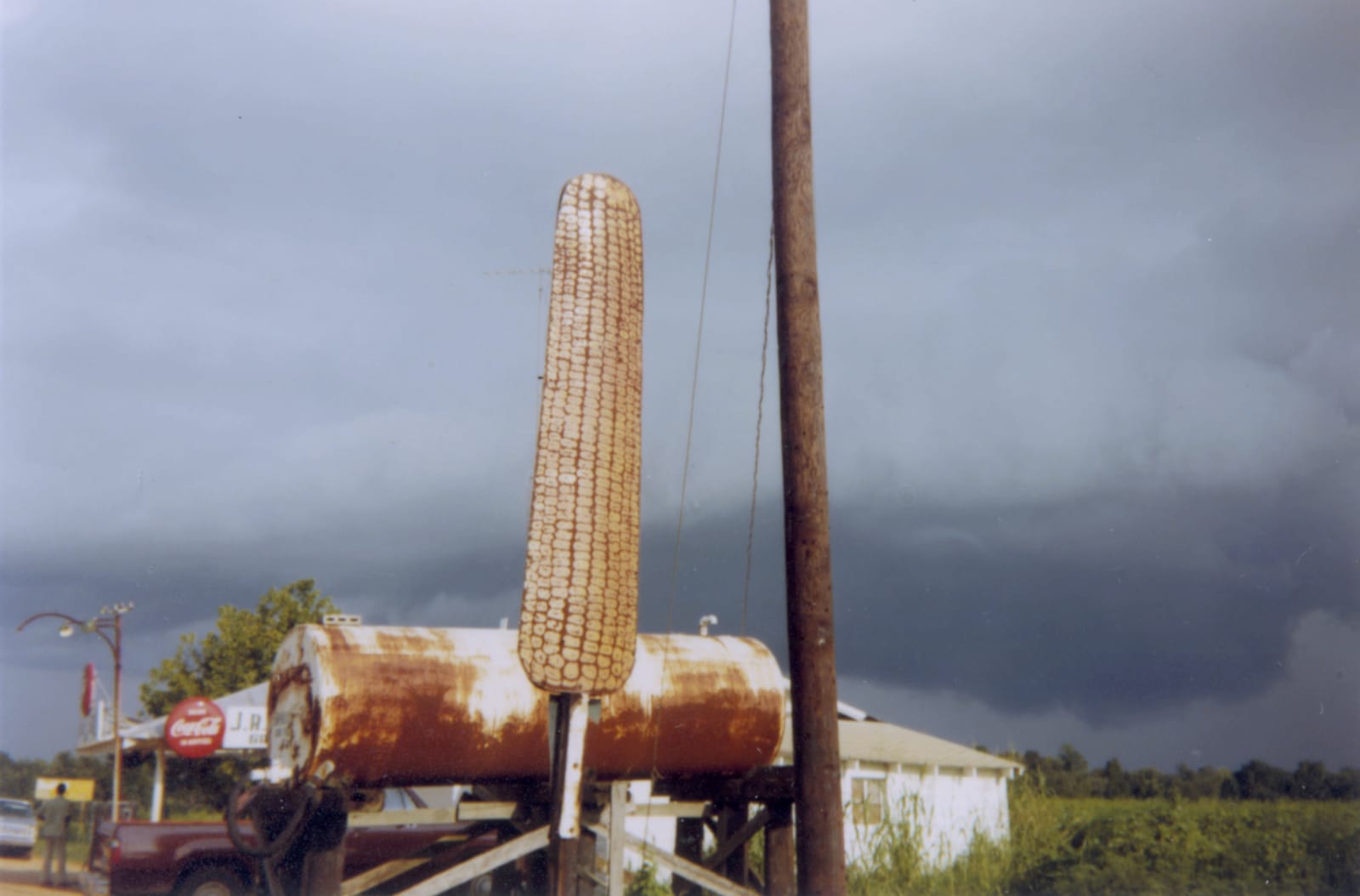 William Christenberry, Corn Sign with Storm Cloud, Near Greensboro, Alabama, 1977