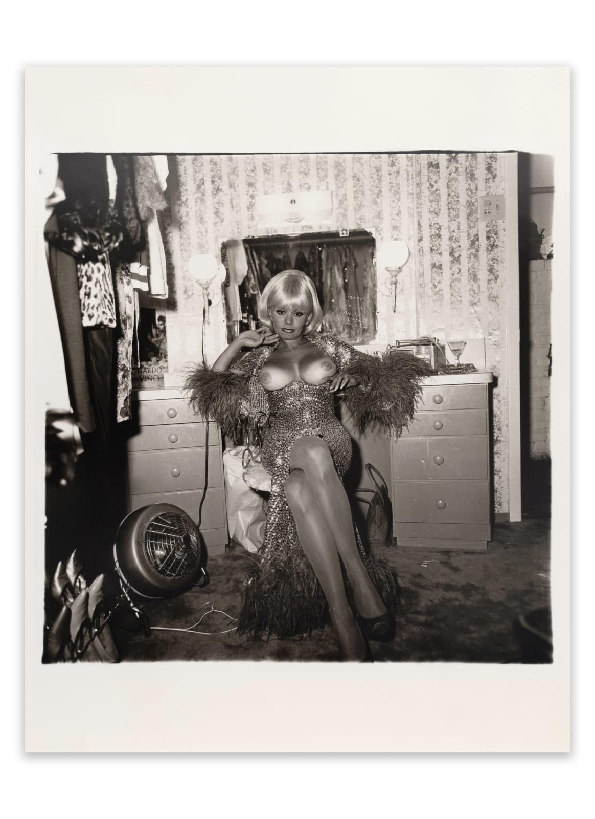 Diane Arbus, Topless dancer in her dressing room, San Francisco, CA , 1968