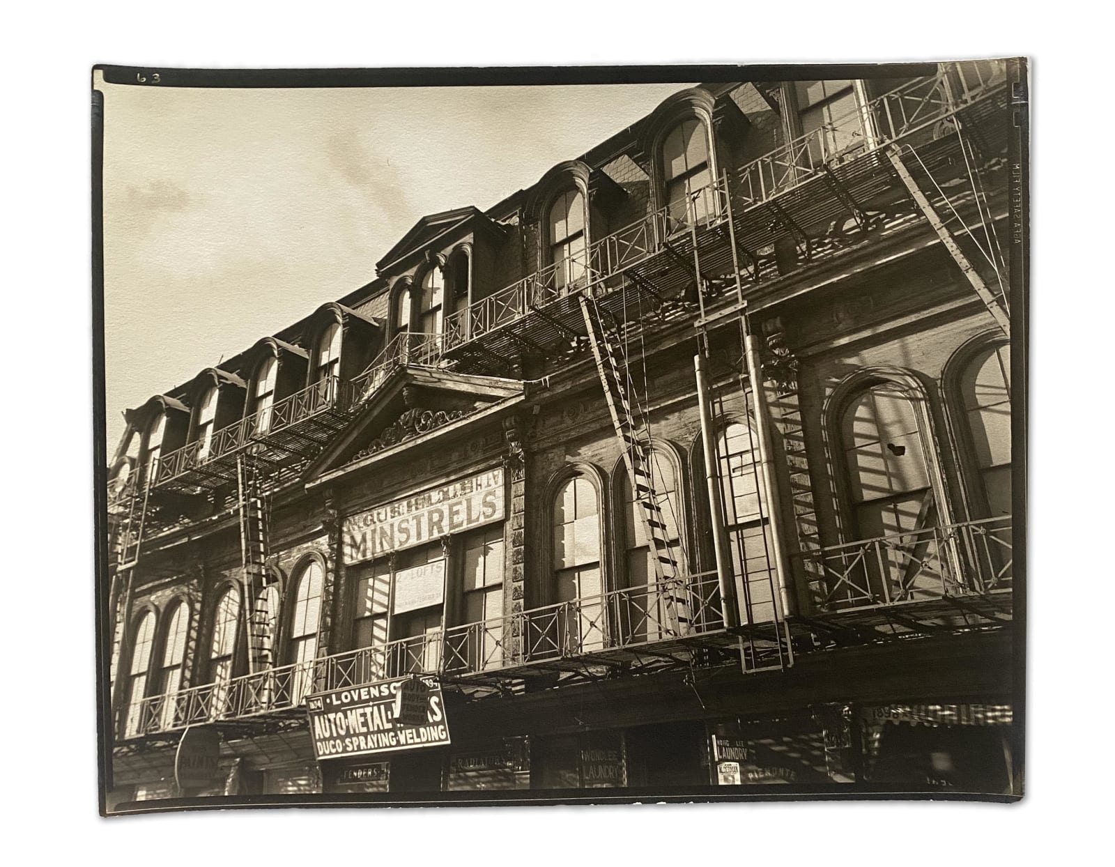 Berenice Abbott, NORTH OF 59TH: "Gus Hill's Minstrels," Park Avenue and 129th Streets, Manhattan, December 19, 1935