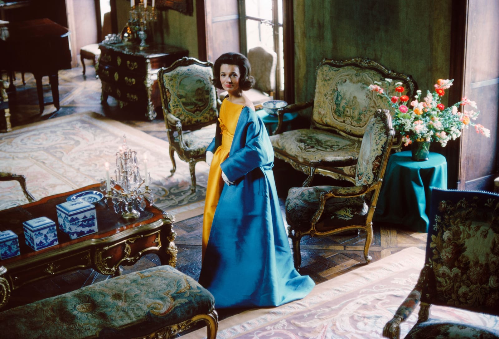 Mark Shaw, Socialite Lee Radziwill (Blue Cape in Brocade Room. Her blue cape and gold satin dress are by Nina Ricci), 1962