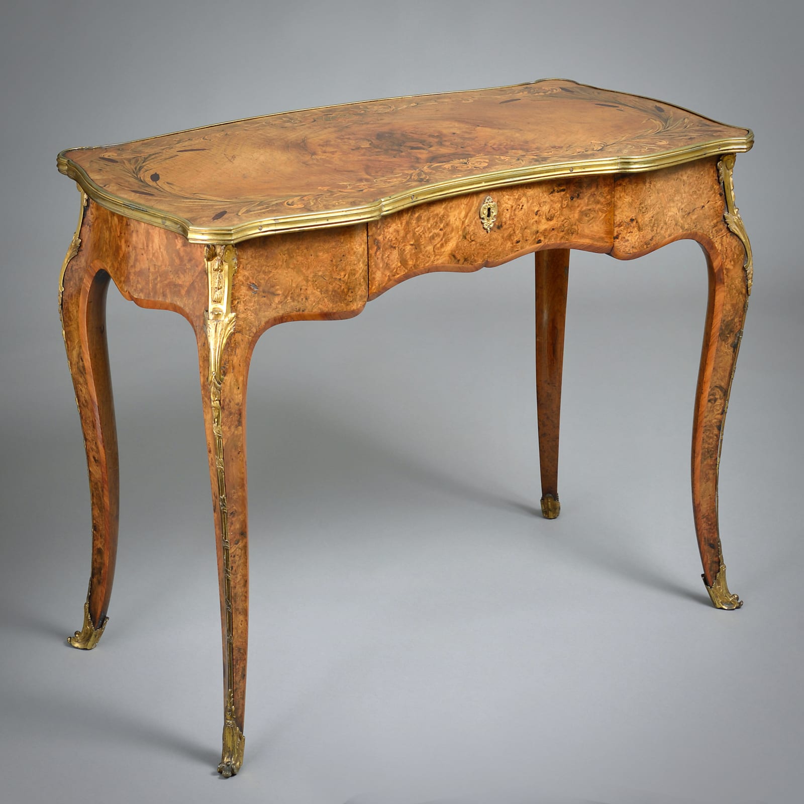 EARLY VICTORIAN ORMOLU-MOUNTED BURR-WALNUT MARQUETRY WRITING TABLE