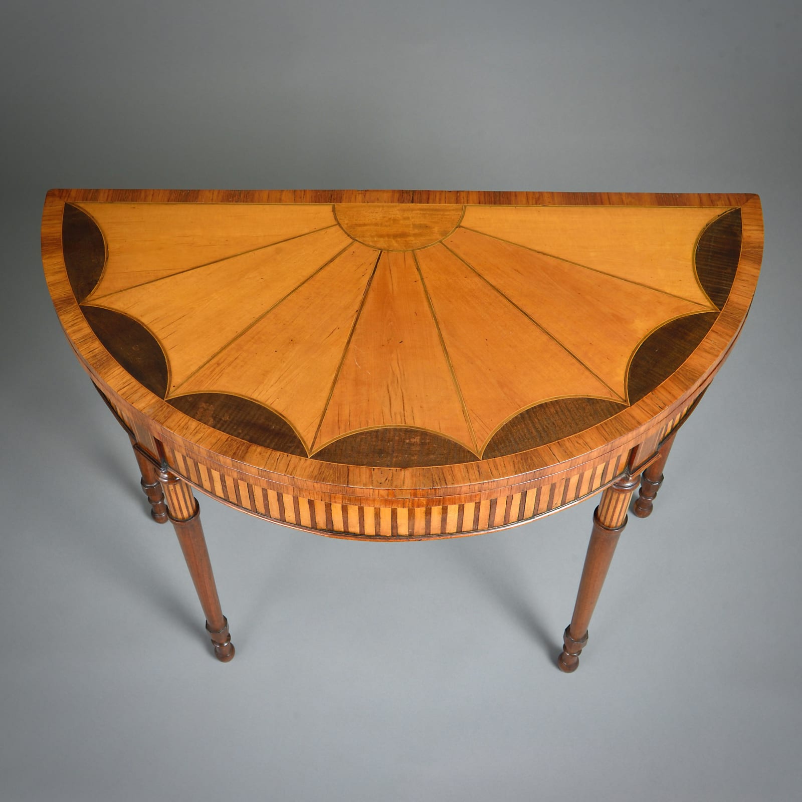 GEORGE III SATINWOOD AND MAHOGANY DEMI-LUNE CARD TABLE